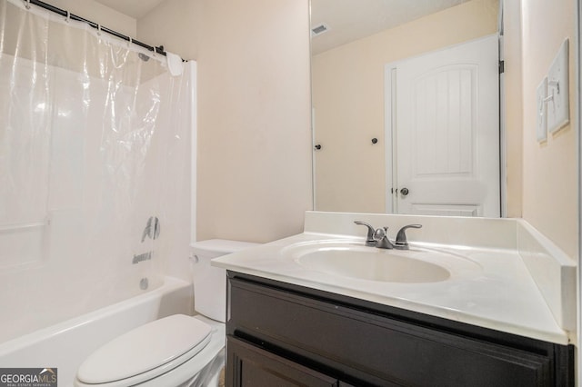 full bathroom featuring vanity, shower / bath combo, and toilet