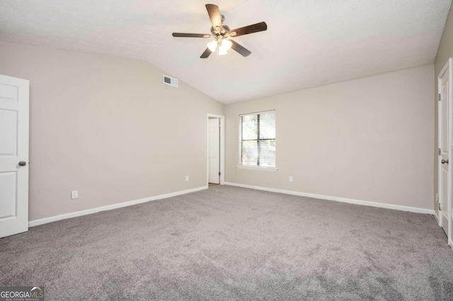 unfurnished bedroom with carpet flooring, ceiling fan, and lofted ceiling