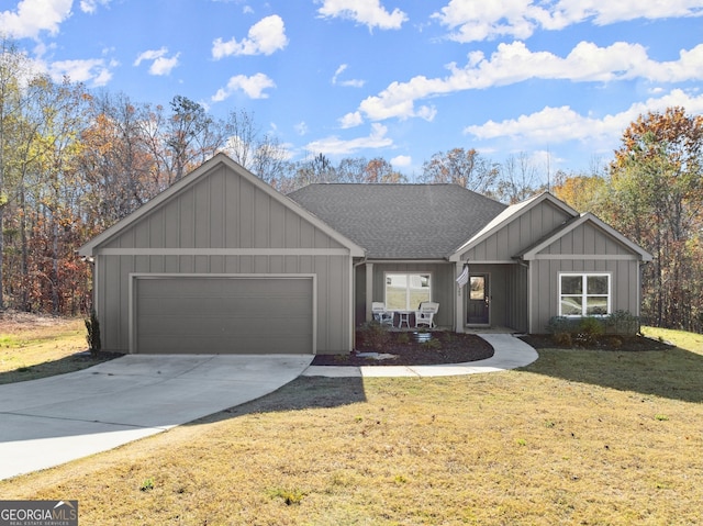 ranch-style house with a front yard and a garage