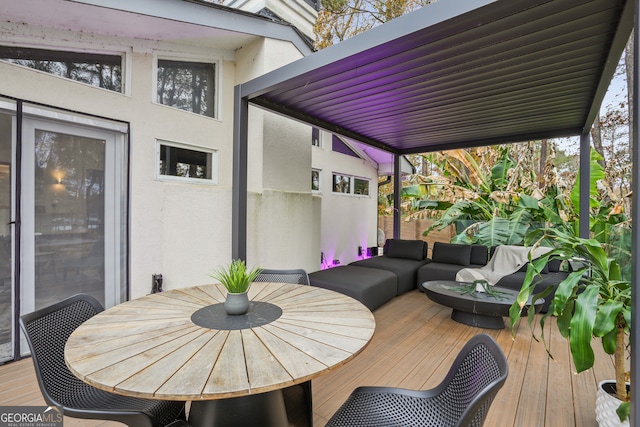 wooden terrace featuring an outdoor hangout area