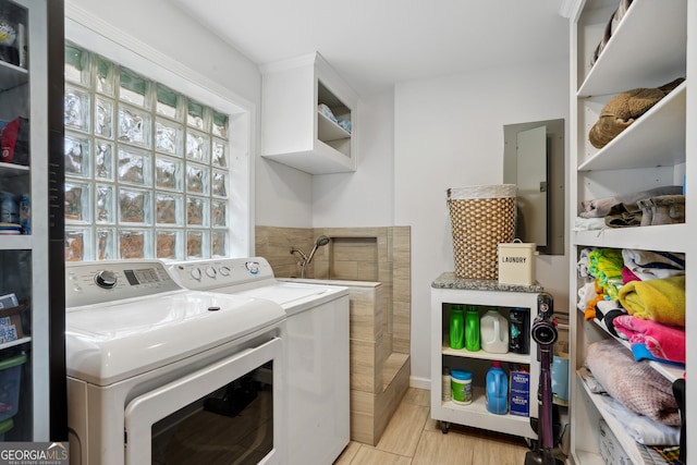 laundry room featuring washer and dryer and electric panel