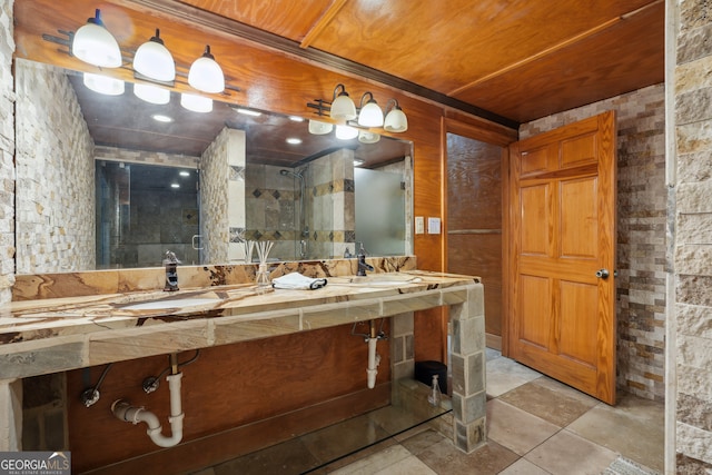 bathroom featuring a shower with door, wood ceiling, and sink