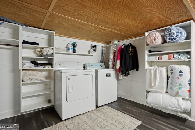 laundry area featuring dark hardwood / wood-style floors, washer and dryer, and wooden ceiling