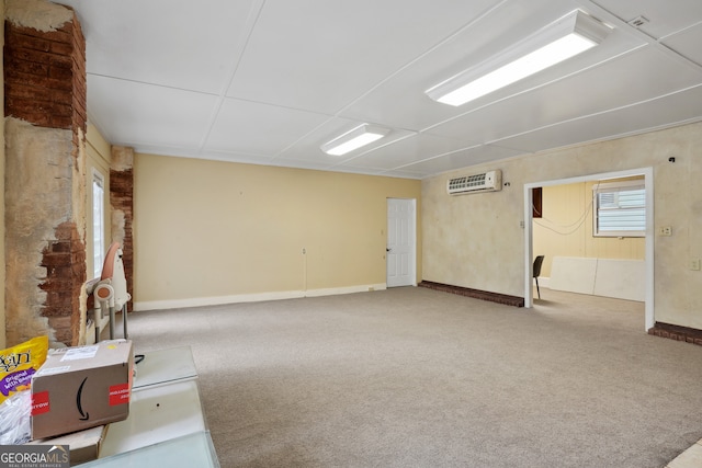 basement featuring a wall unit AC and carpet floors