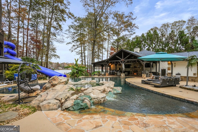 view of swimming pool featuring an outdoor hangout area and a patio