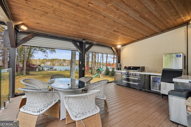 deck with area for grilling, beverage cooler, and grilling area