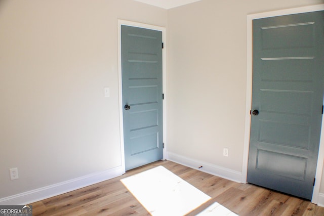 unfurnished room featuring light hardwood / wood-style floors