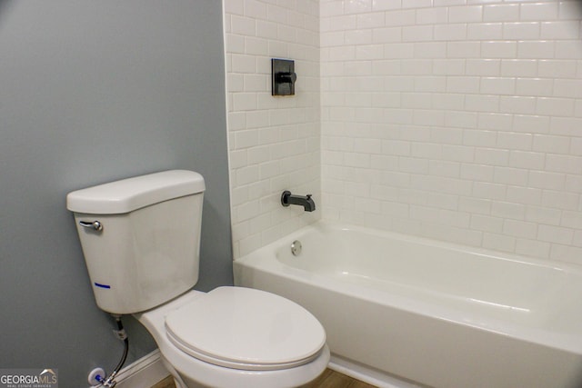 bathroom with shower / bathtub combination and toilet