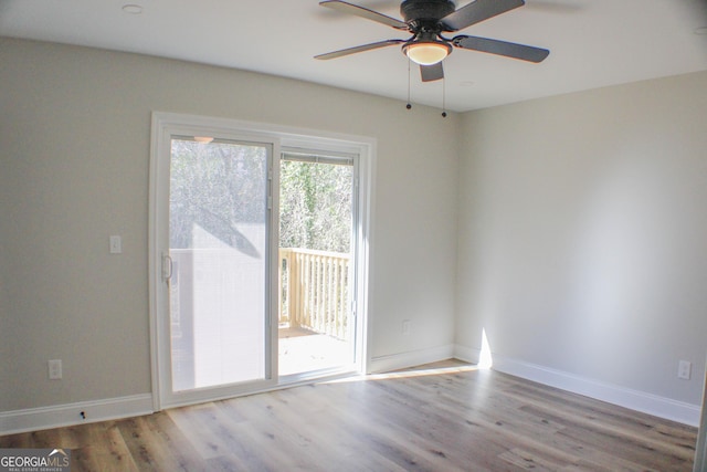 unfurnished room featuring light hardwood / wood-style floors and ceiling fan