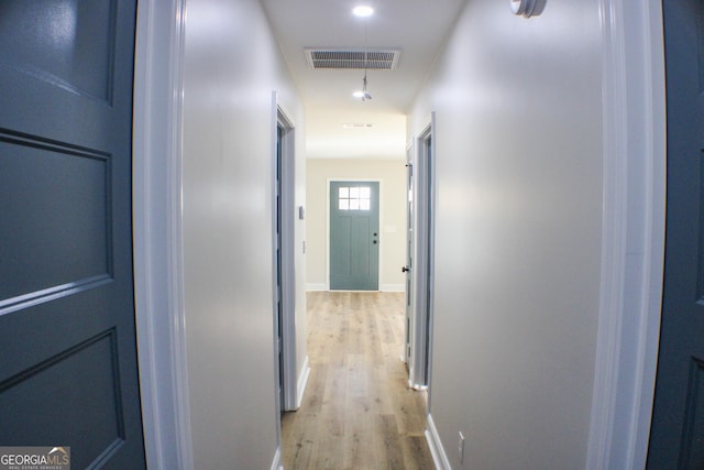 hall with light wood-type flooring