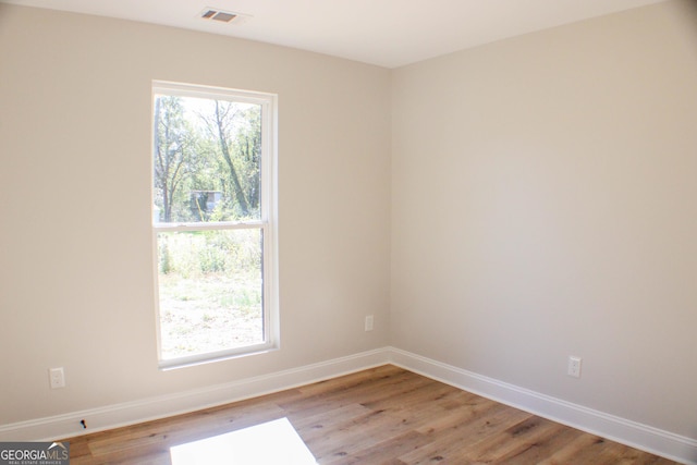 unfurnished room featuring light hardwood / wood-style floors