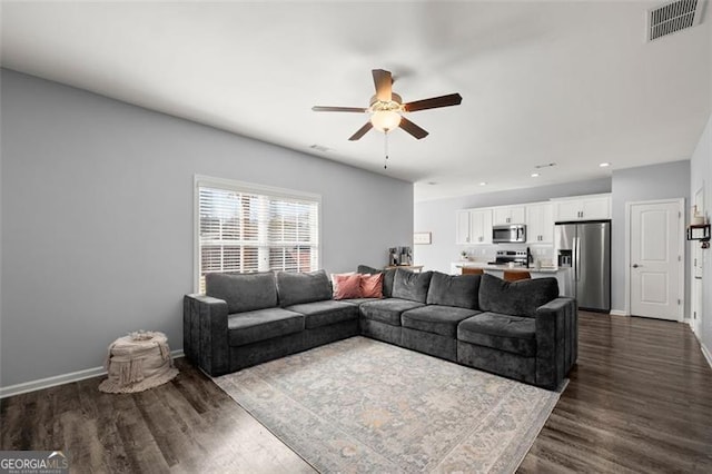 living room featuring visible vents, a ceiling fan, dark wood-style floors, recessed lighting, and baseboards