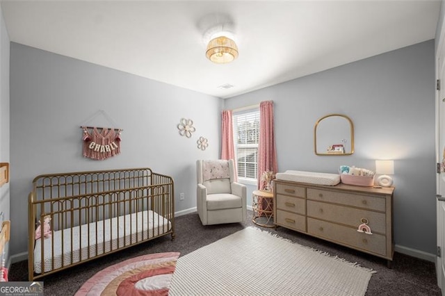 carpeted bedroom with a crib