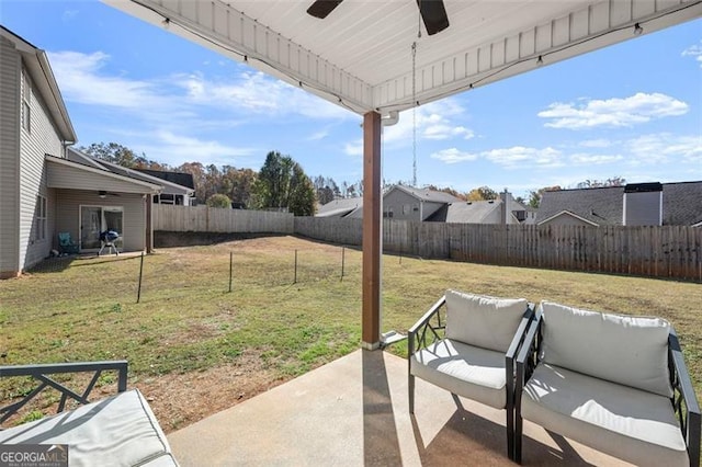 view of patio featuring ceiling fan