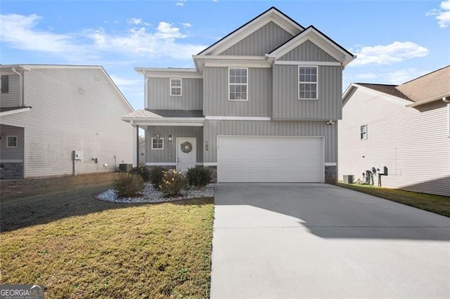 view of front of home with a garage and a front lawn