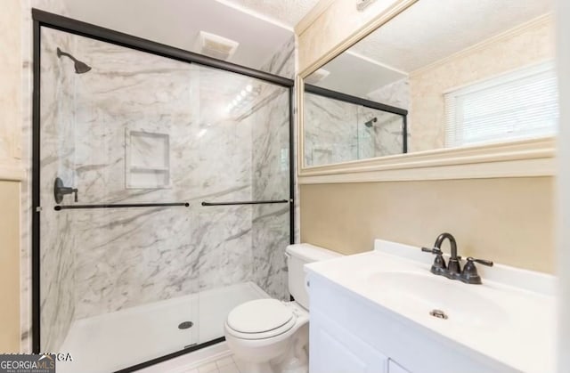 bathroom featuring crown molding, a textured ceiling, toilet, a shower with door, and vanity