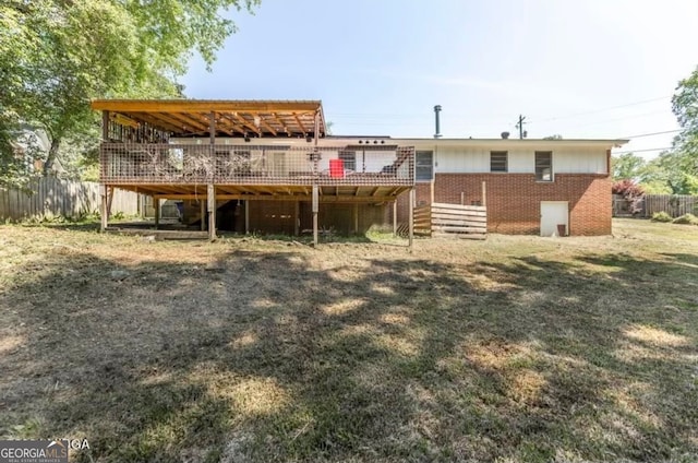 rear view of house featuring a deck