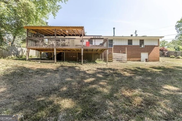 2982 Woodhaven Cir, Macon, GA 31204 - rear view of house featuring a deck, brick siding, and stairway