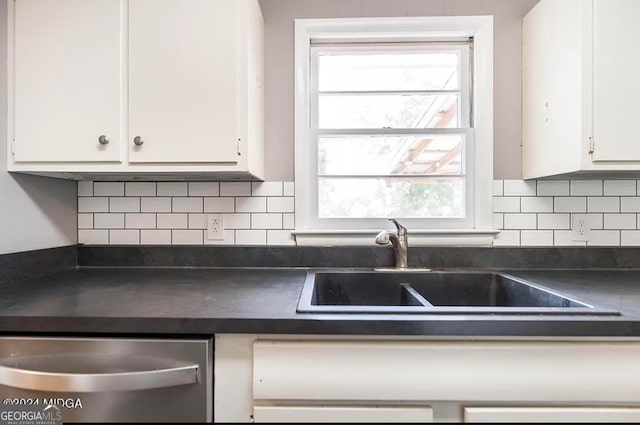 kitchen with backsplash, sink, white cabinets, and a healthy amount of sunlight