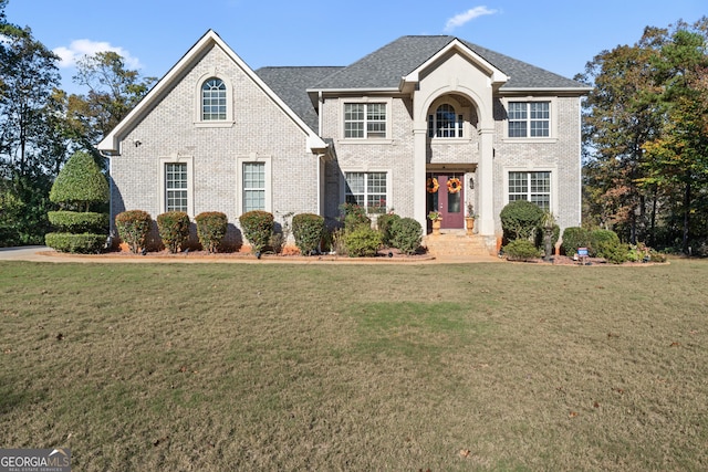 2202 Escalade Ct, Conyers, GA 30094 - view of front facade with a front lawn and brick siding