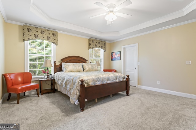2202 Escalade Ct, Conyers, GA 30094 - carpeted bedroom featuring a raised ceiling, multiple windows, ornamental molding, and ceiling fan