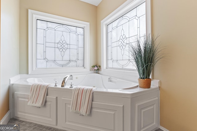 2202 Escalade Ct, Conyers, GA 30094 - bathroom with a garden tub