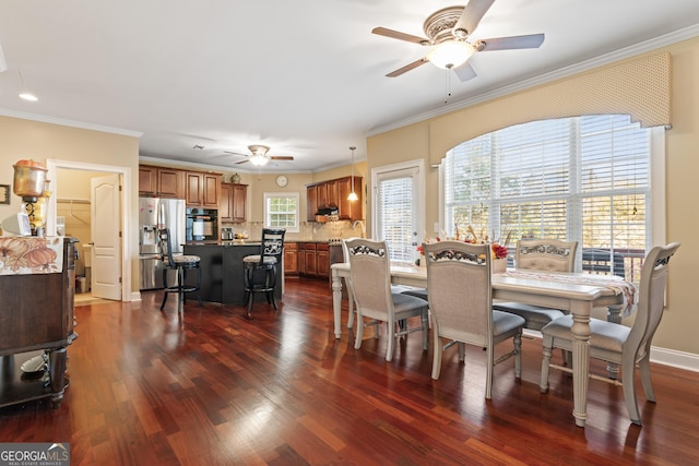 2202 Escalade Ct, Conyers, GA 30094 - dining space with ceiling fan, dark wood-type flooring, and crown molding