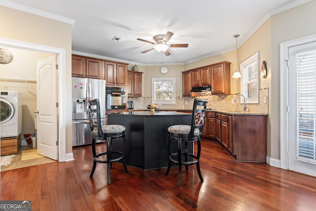 2202 Escalade Ct, Conyers, GA 30094 - kitchen with stainless steel fridge, washer / clothes dryer, oven, ceiling fan, and a kitchen bar