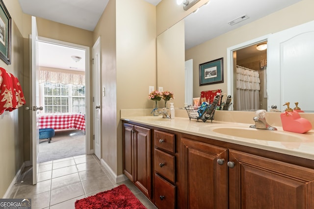 2202 Escalade Ct, Conyers, GA 30094 - ensuite bathroom featuring double vanity and tile patterned floors