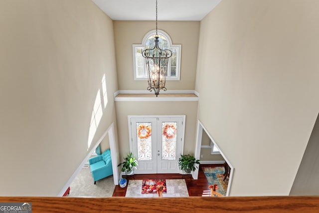 2202 Escalade Ct, Conyers, GA 30094 - entrance foyer with a chandelier, healthy amount of natural light, and a towering ceiling