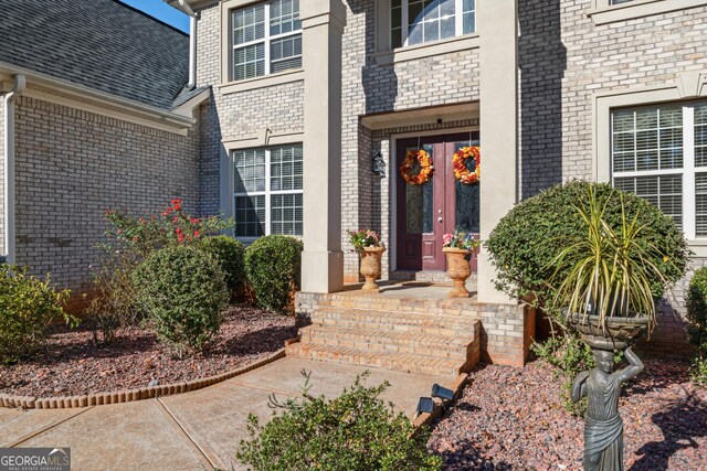 2202 Escalade Ct, Conyers, GA 30094 - property entrance featuring brick siding and roof with shingles