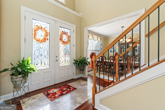 2202 Escalade Ct, Conyers, GA 30094 - foyer entrance featuring french doors, stairway, marble finish floors, and ornamental molding