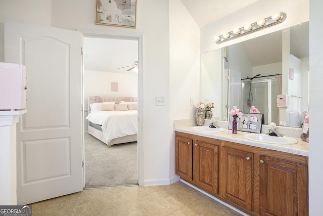 6476 Snowden, Atlanta, GA 30349 - full bathroom featuring double vanity, ensuite bath, a shower with door, a ceiling fan, and tile patterned flooring