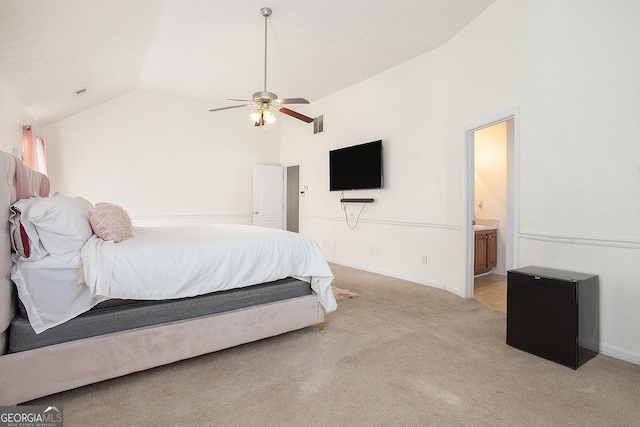 bedroom featuring lofted ceiling, light colored carpet, visible vents, and baseboards