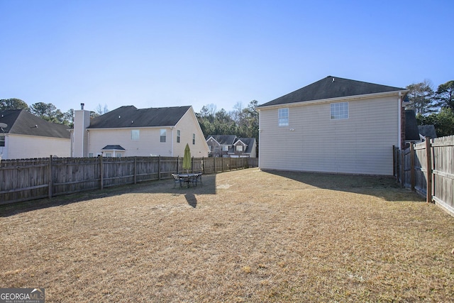 view of yard featuring a fenced backyard