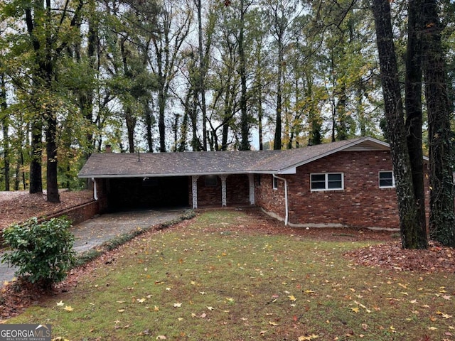 ranch-style home with a front lawn and a carport