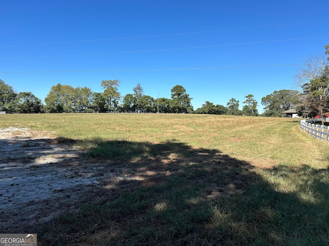 view of yard with a rural view