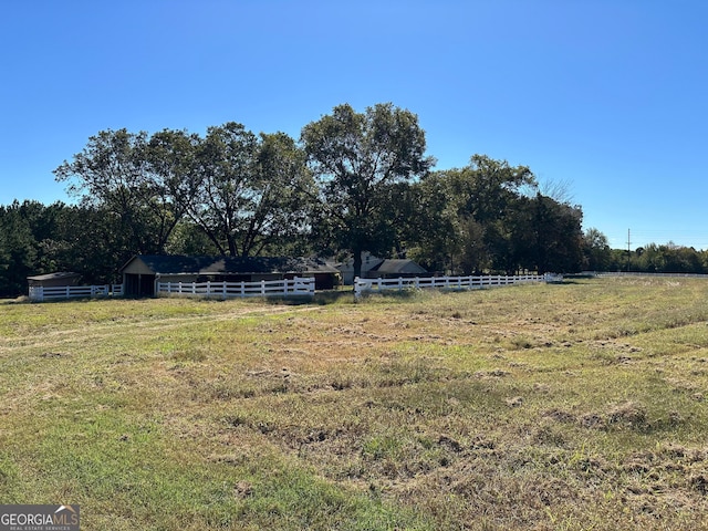 view of yard with a rural view