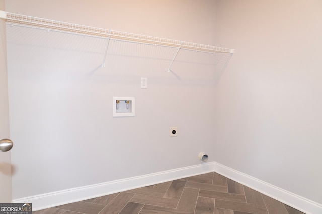 laundry area featuring hookup for an electric dryer, washer hookup, and parquet floors