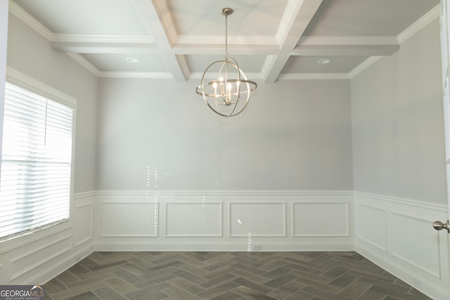 unfurnished room featuring plenty of natural light, beamed ceiling, ornamental molding, and a notable chandelier