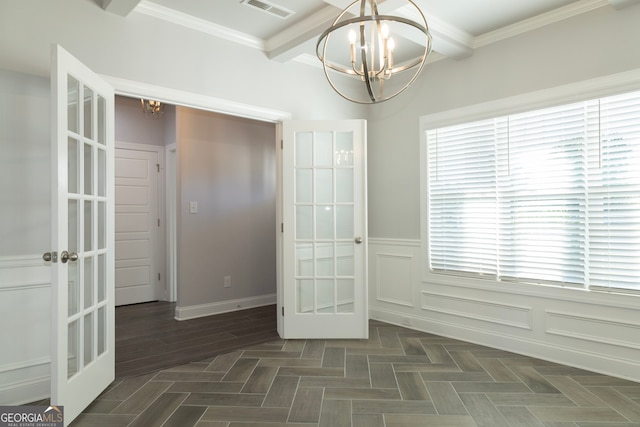 unfurnished dining area with beam ceiling, french doors, crown molding, and a chandelier