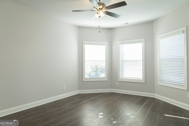 unfurnished room featuring ceiling fan and dark hardwood / wood-style flooring