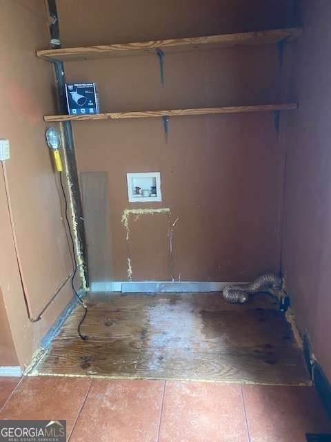 laundry room featuring hookup for a washing machine and tile patterned floors