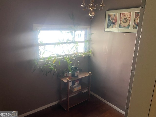 doorway to outside with a healthy amount of sunlight and a notable chandelier