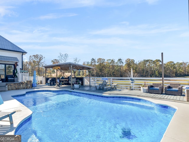 view of swimming pool with a gazebo and a patio area