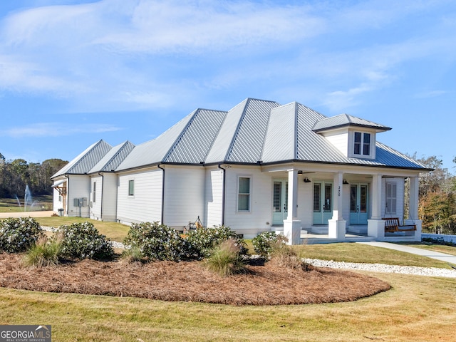 view of front facade with covered porch and a front yard