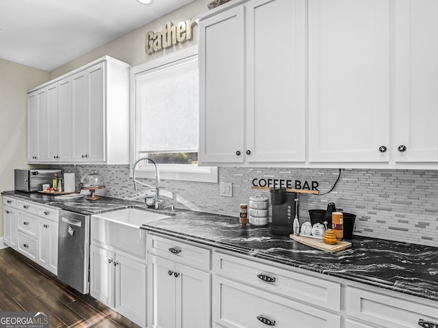 kitchen featuring dark hardwood / wood-style flooring, white cabinetry, and dishwasher