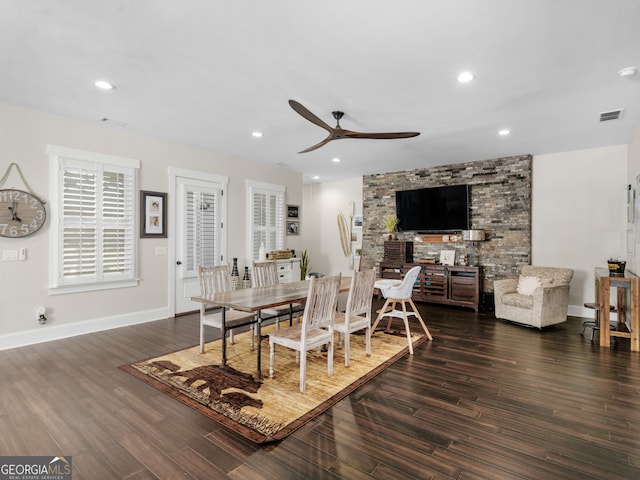 dining area with ceiling fan and dark hardwood / wood-style flooring