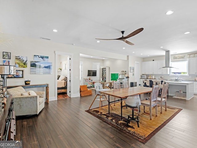 dining room featuring dark hardwood / wood-style flooring and ceiling fan