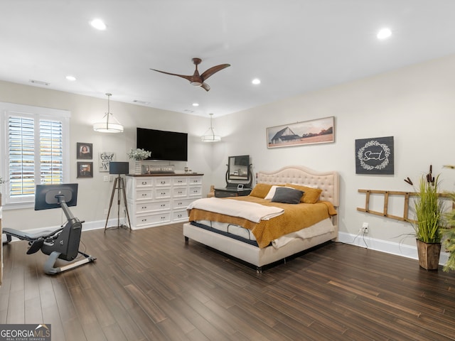 bedroom with ceiling fan and dark wood-type flooring